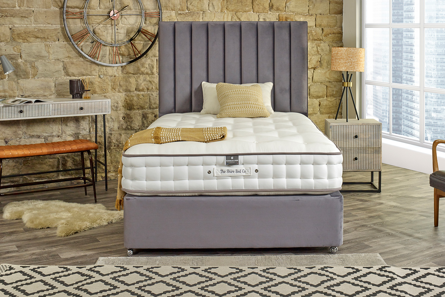 Grey Clifton Bed from Brunel Beds featuring a statement headboard.