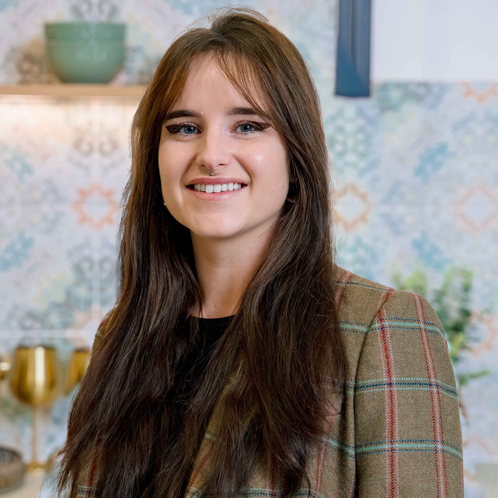 Lucy, a bathroom designer, smiling at the camera.